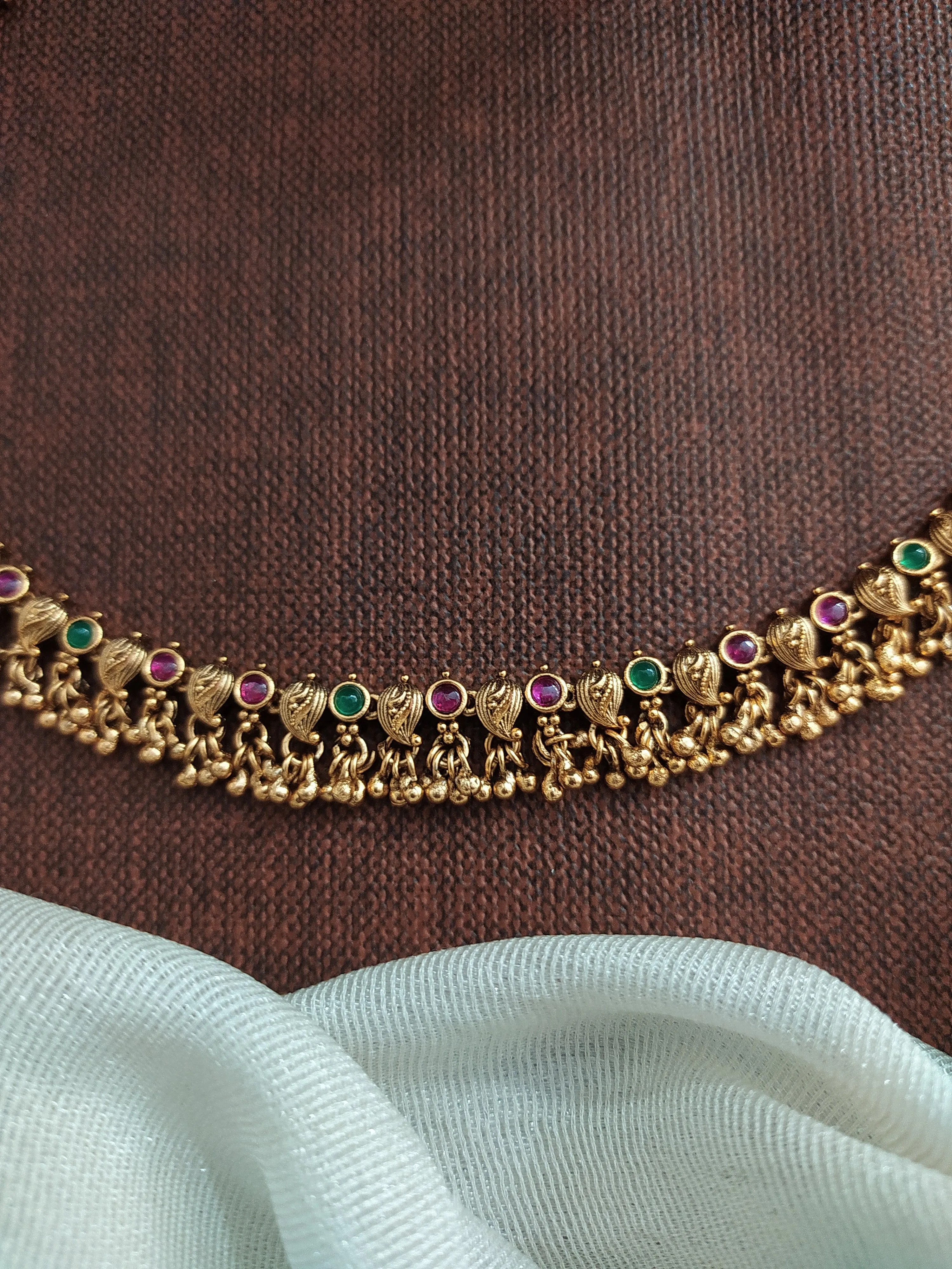 Antique Mango-Designed Anklets with Kemp and Green Stones, and Small Golden Ball Drops