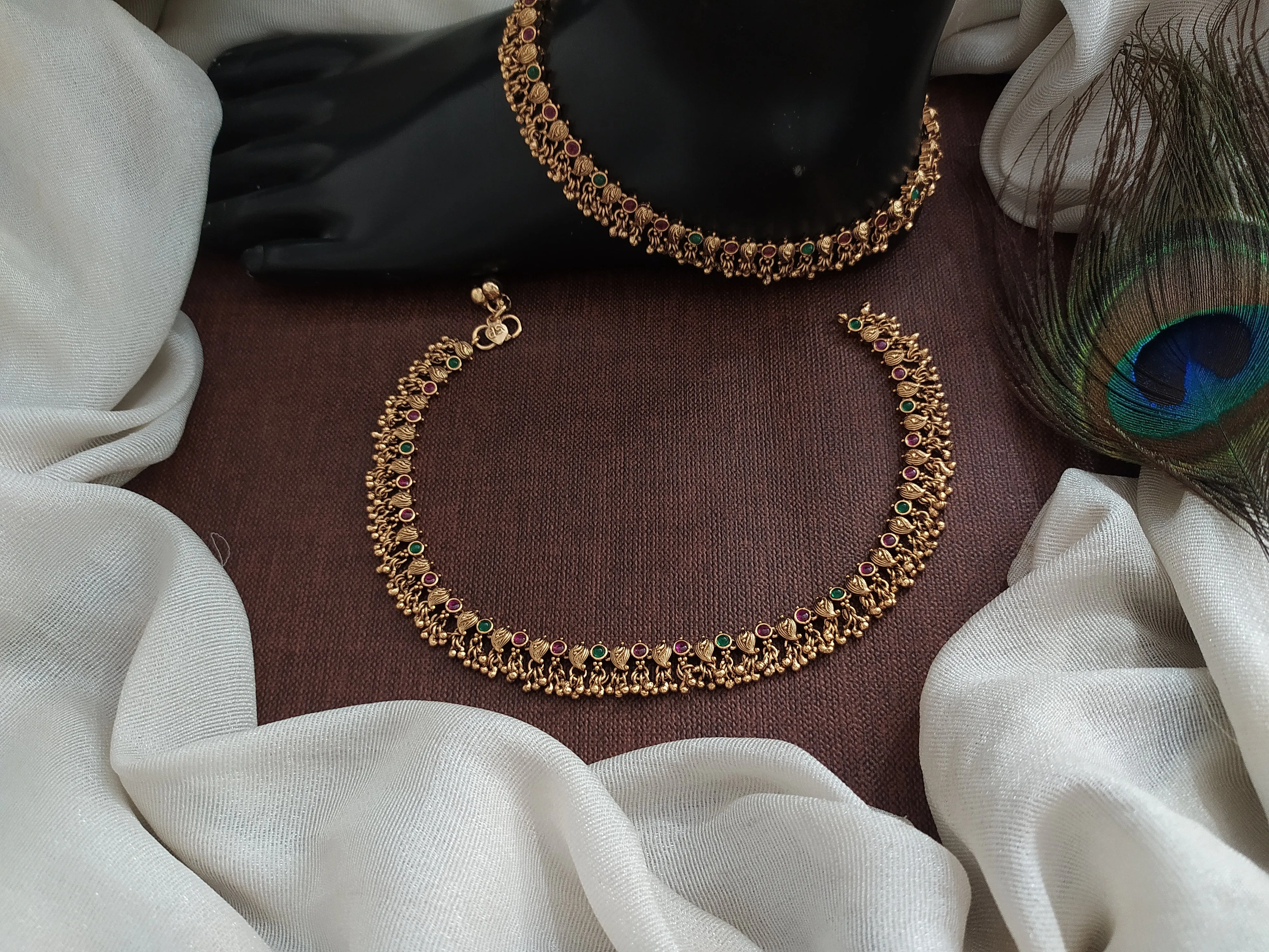 Antique Mango-Designed Anklets with Kemp and Green Stones, and Small Golden Ball Drops