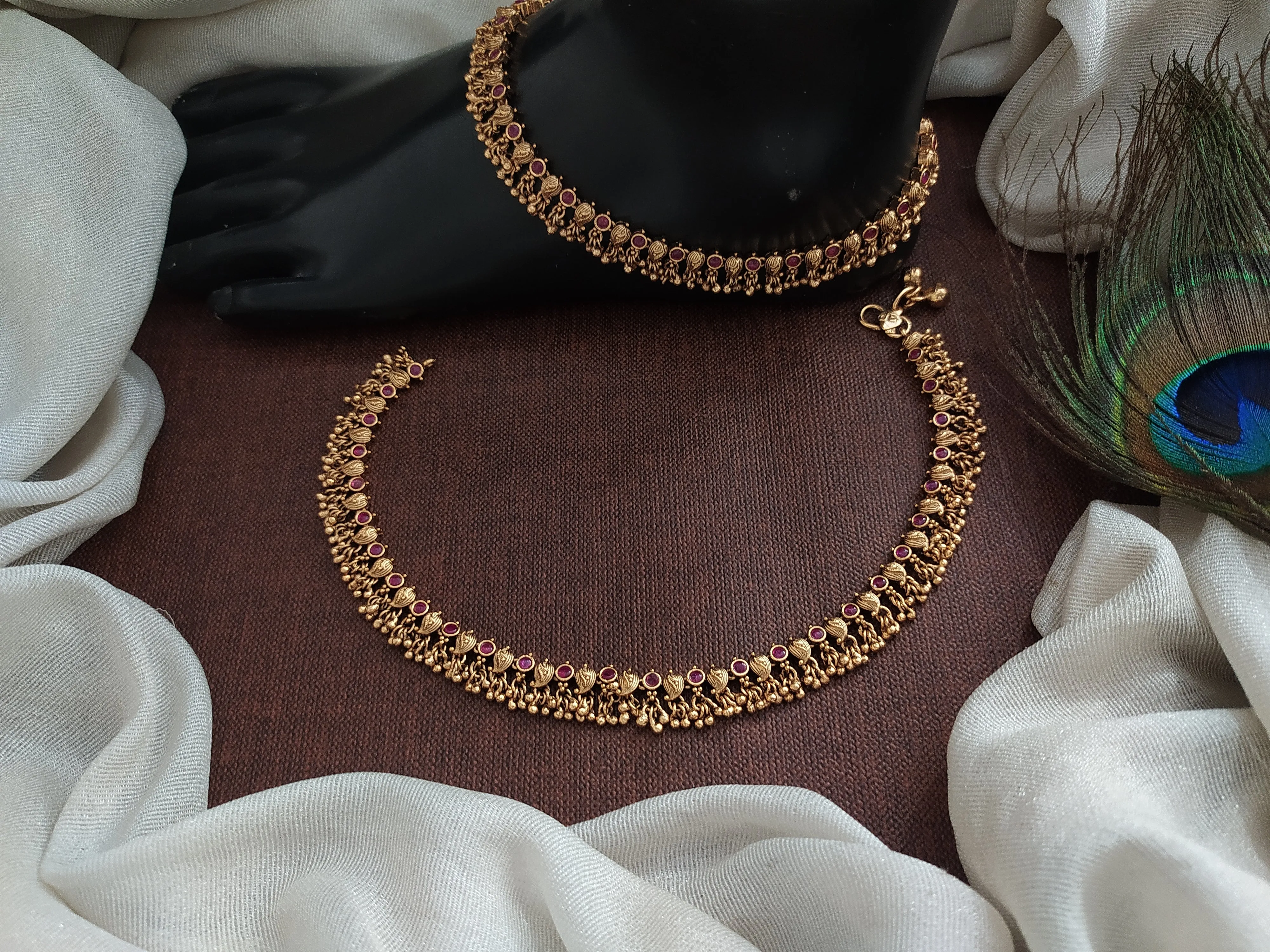 Antique Mango-Designed Anklets with Kemp and Green Stones, and Small Golden Ball Drops